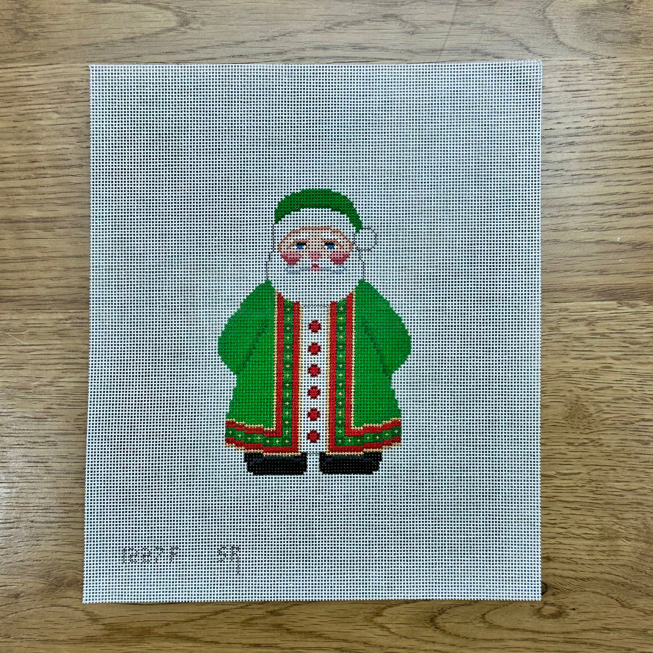 SR1227f Green Coat Santa with Present - 18 mesh - TS