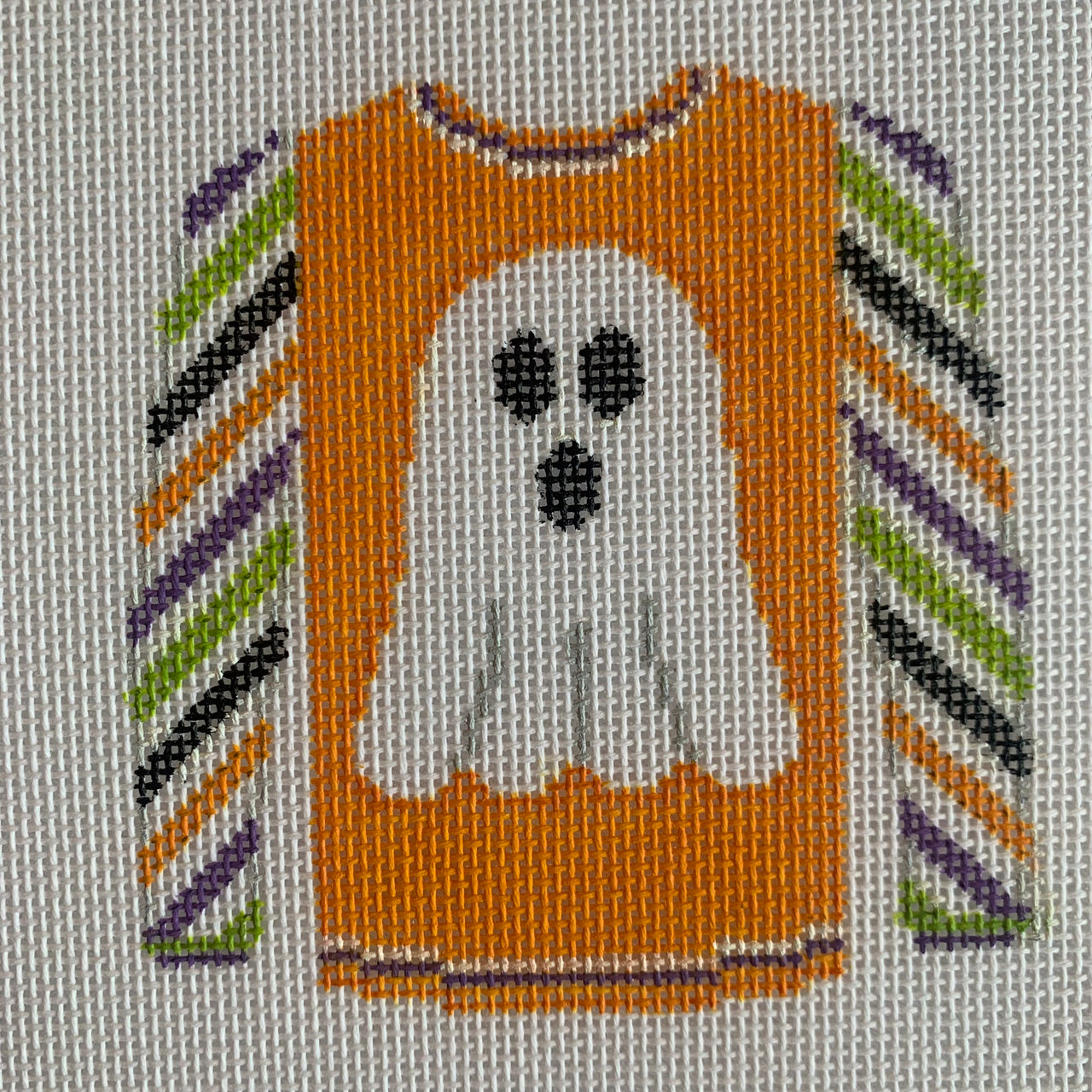 KKO220E Ghost on Orange Sweater with multicolored sleeves