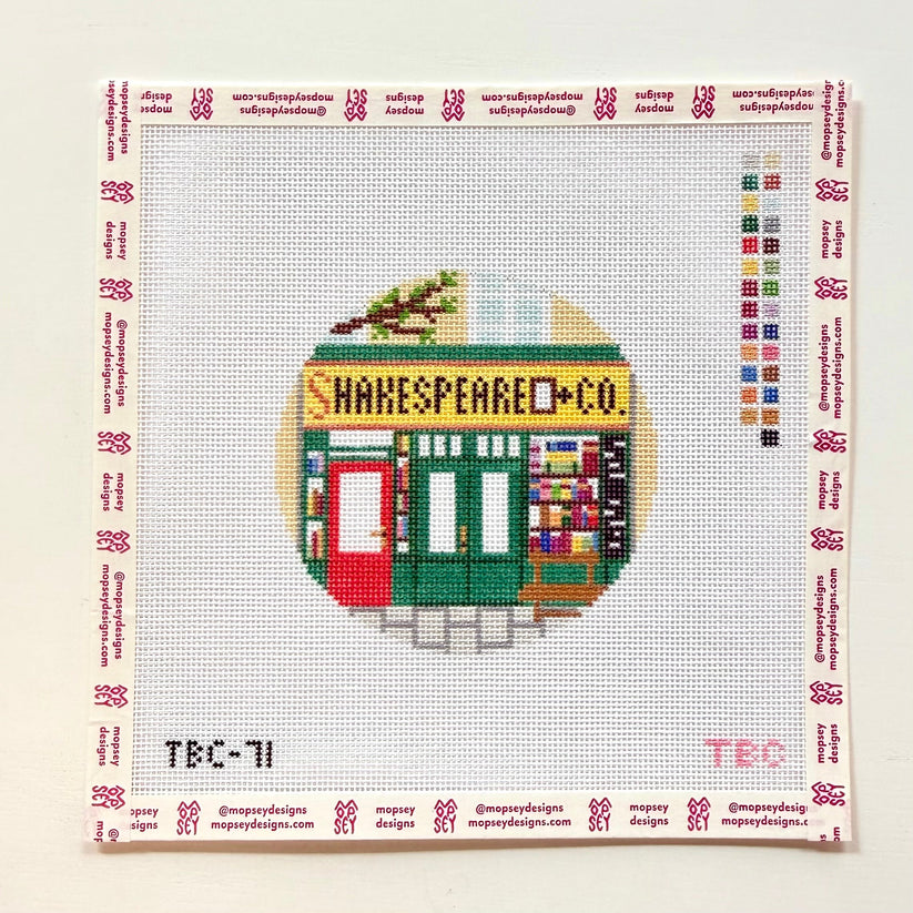 needlepoint canvas with a charming book store store front

